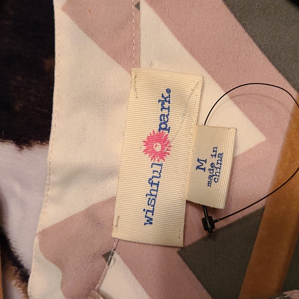 Colorful Top. Small spot on left sleeve.